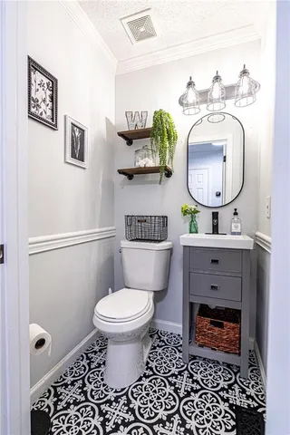 a kitchen with stainless steel appliances wooden floor and refrigerator