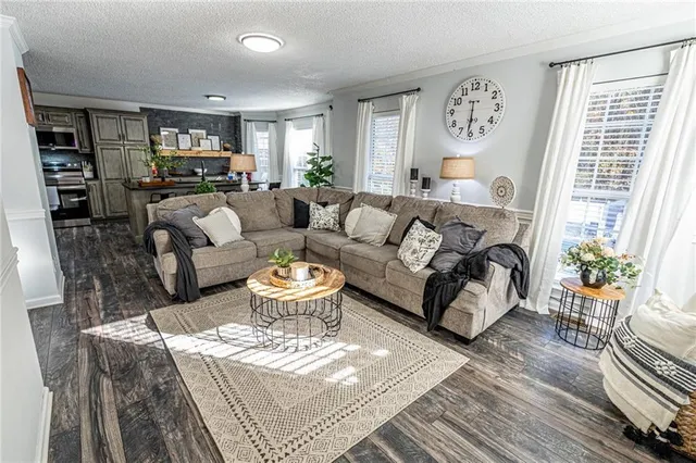 a bathroom with a sink a toilet a mirror and shower