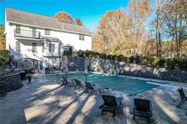 a kitchen with sink refrigerator and window