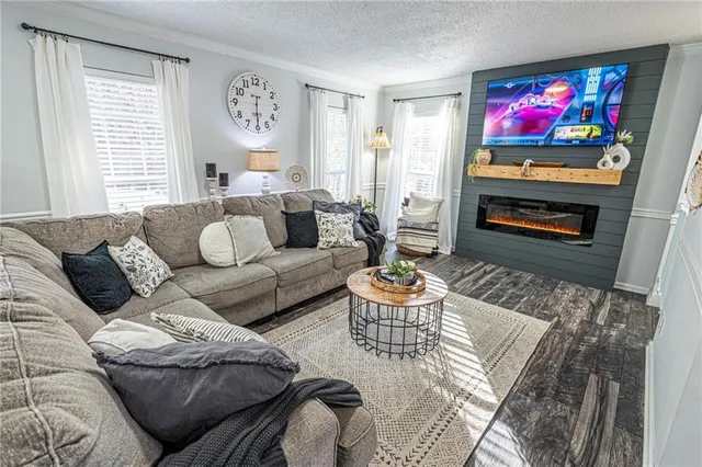 a kitchen with a sink cabinets and wooden floor