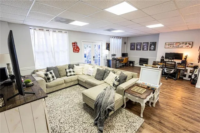 a view of a brick house with many windows and potted plants