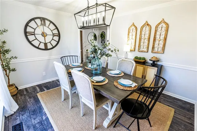 a living room with furniture a rug a window and a mirror