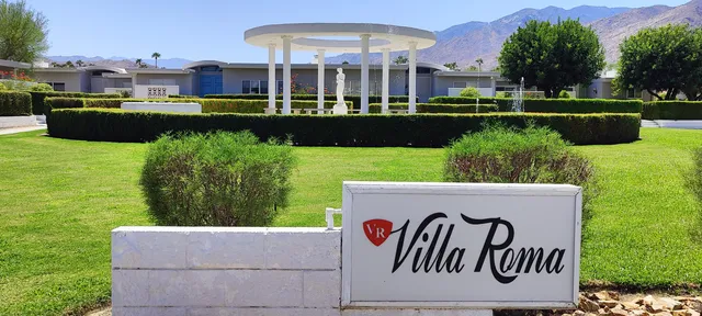 a view of empty room with window and fireplace
