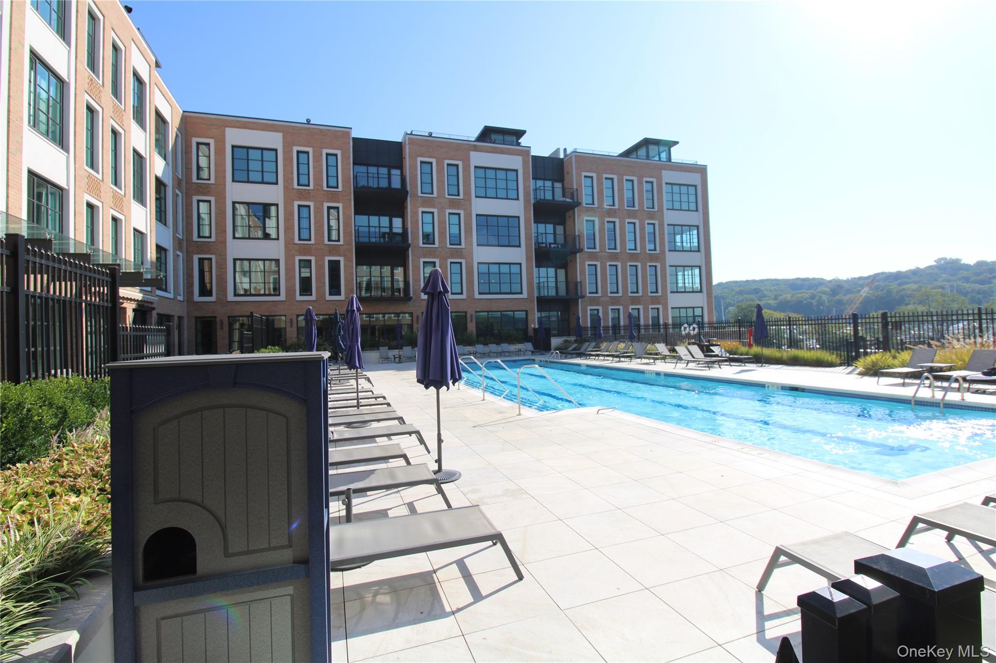 100 Garvies Point Road, Unit 1039 Glen Cove, NY 11542 - Photo 12 of 12 a front view of a building with garden