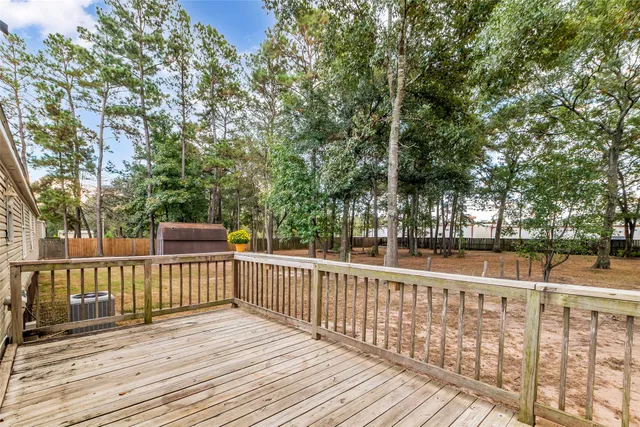 a view of deck with wooden floor and fence