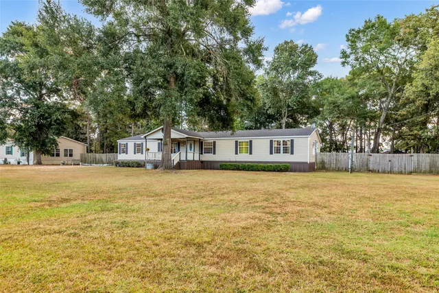 a front view of a house with a swimming pool