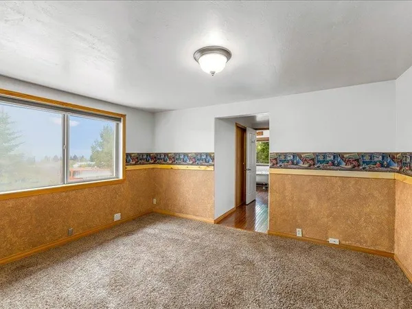 a view of a kitchen area with furniture and windows