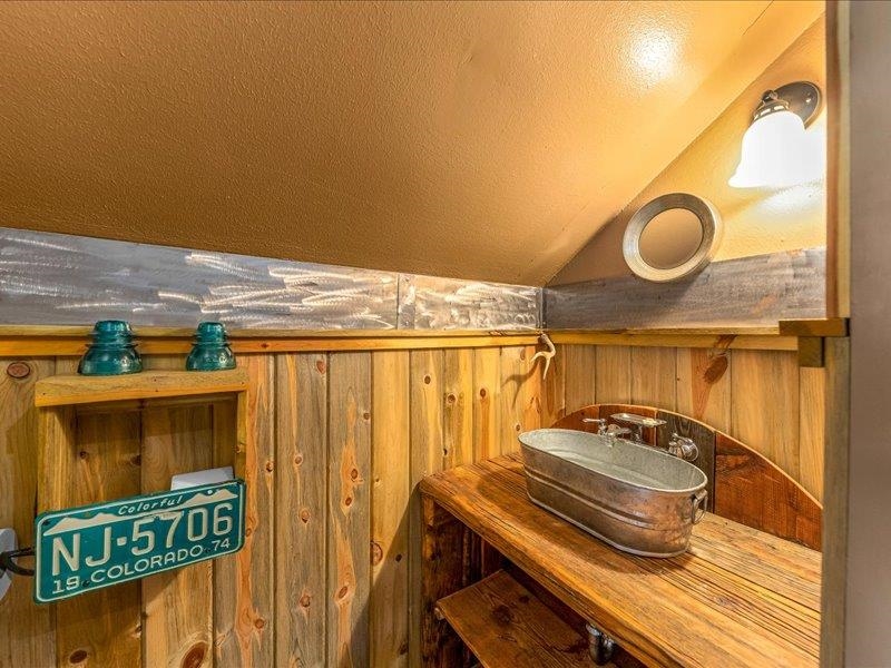 17969 Surface Creek Road Cedaredge, CO 81413 - Photo 17 of 34 a bathroom with a sink and a mirror