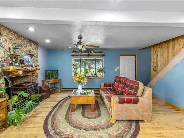 a living room with furniture and a chandelier