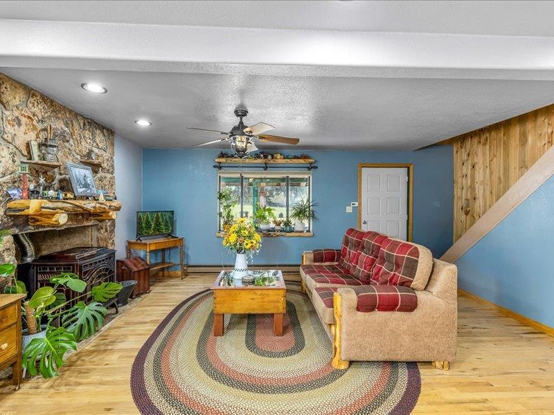 17969 Surface Creek Road Cedaredge, CO 81413 - Photo 6 of 34 a living room with furniture and a chandelier