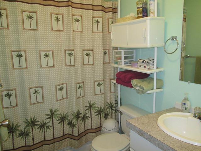 5264 Holland Loop Road Cave Junction, OR 97523 - Photo 13 of 32 a bathroom with a granite countertop toilet sink and mirror