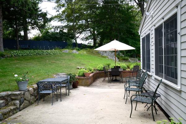 11 Cornell Road Marblehead, MA 01945 - Photo 12 of 28 a view of a patio with furniture and a garden