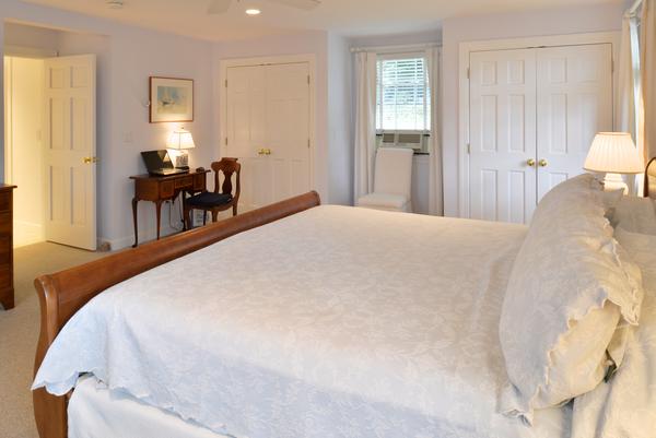 11 Cornell Road Marblehead, MA 01945 - Photo 17 of 28 a bedroom with a bed and a chandelier