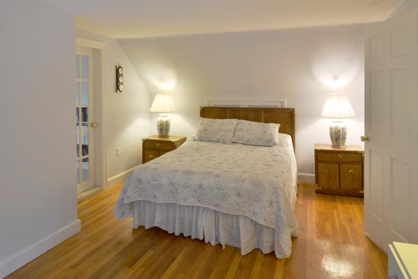 11 Cornell Road Marblehead, MA 01945 - Photo 21 of 28 a bedroom with a bed and a view of wooden floor