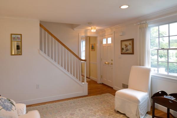 11 Cornell Road Marblehead, MA 01945 - Photo 23 of 28 a hallway with couches and a couch with wooden floor