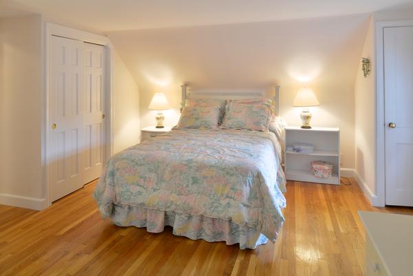 11 Cornell Road Marblehead, MA 01945 - Photo 25 of 28 a bedroom with a bed and wooden floor