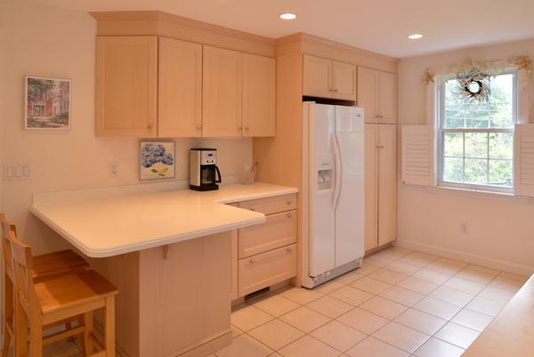 11 Cornell Road Marblehead, MA 01945 - Photo 8 of 28 a kitchen with stainless steel appliances a refrigerator sink and cabinets