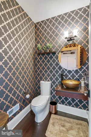 a bathroom with a toilet and a sink