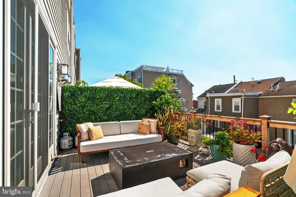 a view of a terrace with couches and table