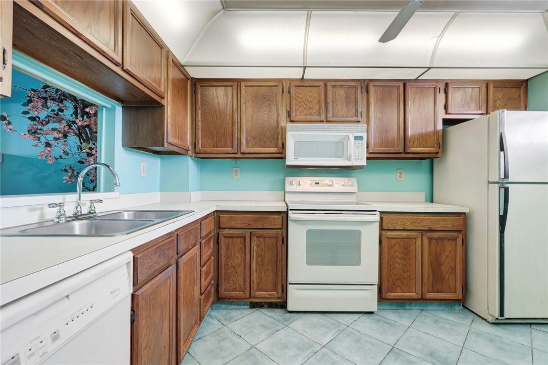 1075 Riverside Drive, Unit 405 Coral Springs, FL 33071 - Photo 17 of 22 Wood Cabinets