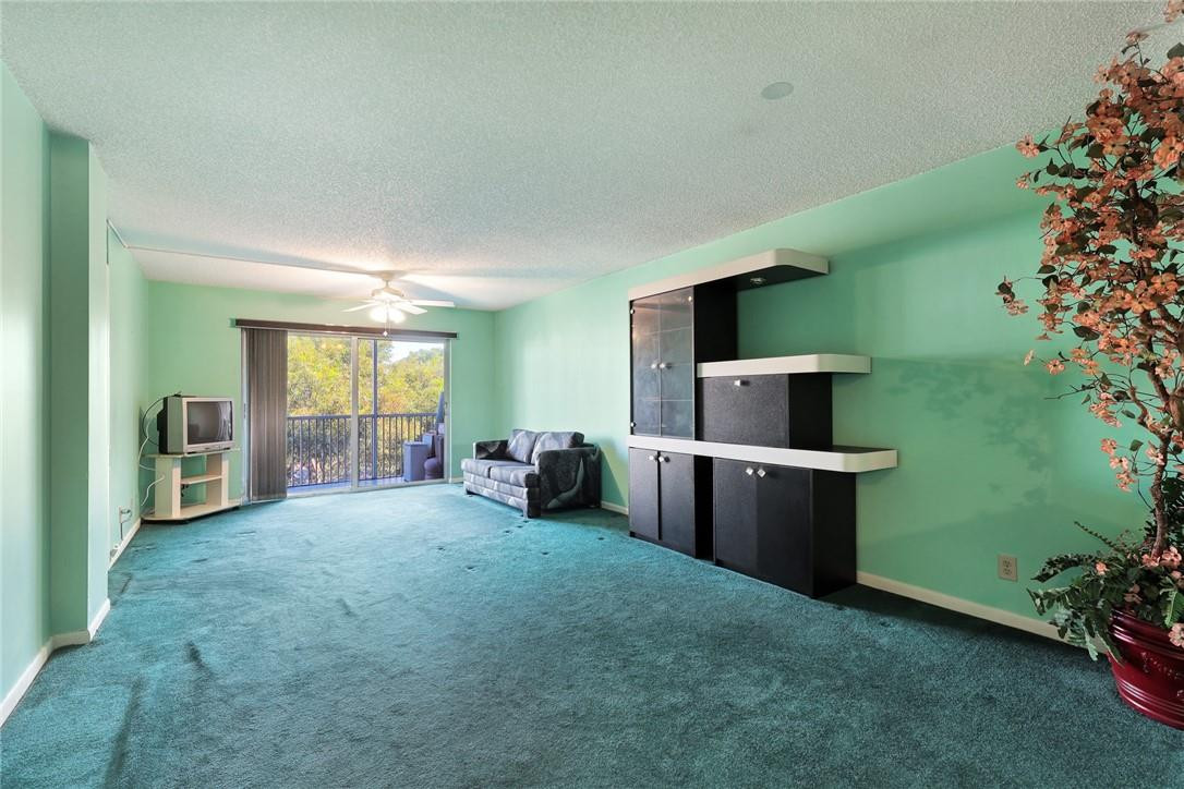 1075 Riverside Drive, Unit 405 Coral Springs, FL 33071 - Photo 10 of 22 Needs new carpeting