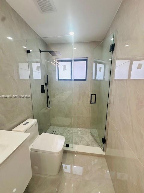 11870 Southwest 5th Street, Unit 1 Miami, FL 33184 - Photo 26 of 38 a bathroom with a toilet and a shower