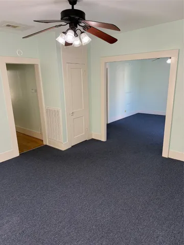a view of empty room with fan