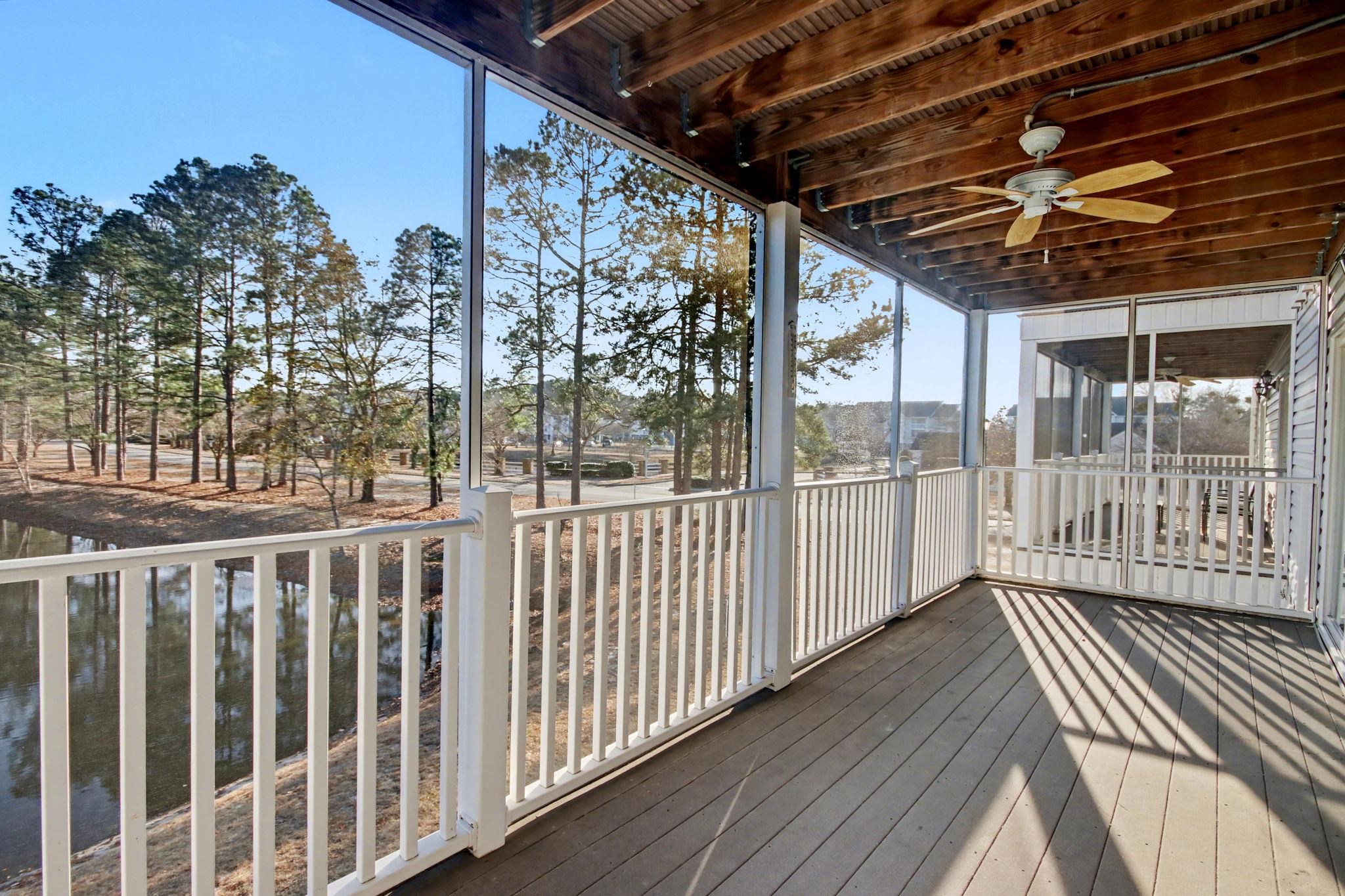 4853 Meadowsweet Drive, Unit 1807 Myrtle Beach, SC 29579 - Photo 28 of 40 Screen porch featuring a water view and a ceiling fan with access from the living room and the primary suite