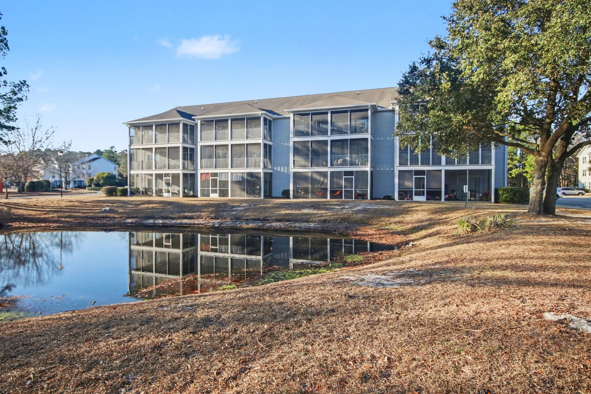 4853 Meadowsweet Drive, Unit 1807 Myrtle Beach, SC 29579 - Photo 31 of 40 View from the back of the building with a water view