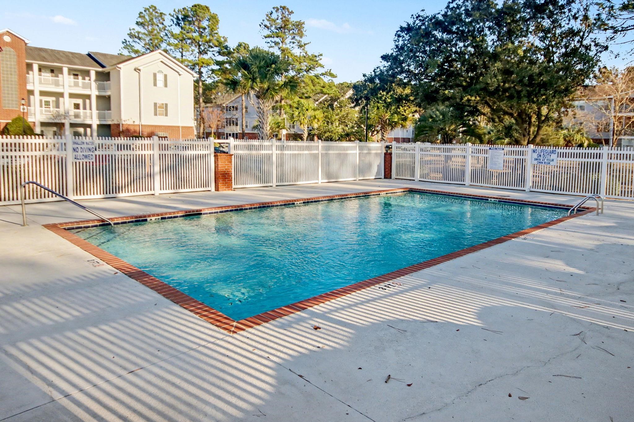 4853 Meadowsweet Drive, Unit 1807 Myrtle Beach, SC 29579 - Photo 32 of 40 Community pool with a patio