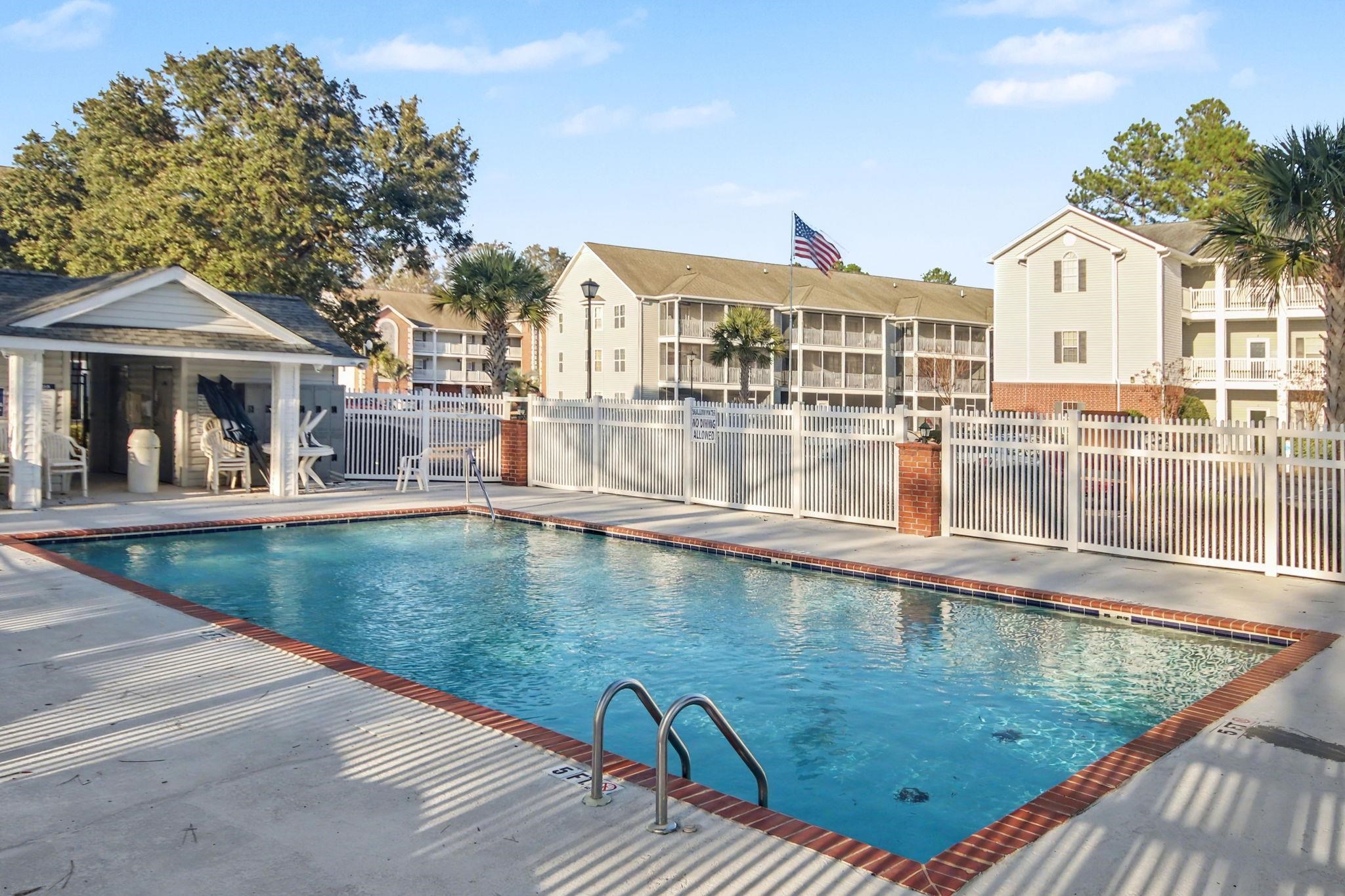 4853 Meadowsweet Drive, Unit 1807 Myrtle Beach, SC 29579 - Photo 34 of 40 Community pool with a patio