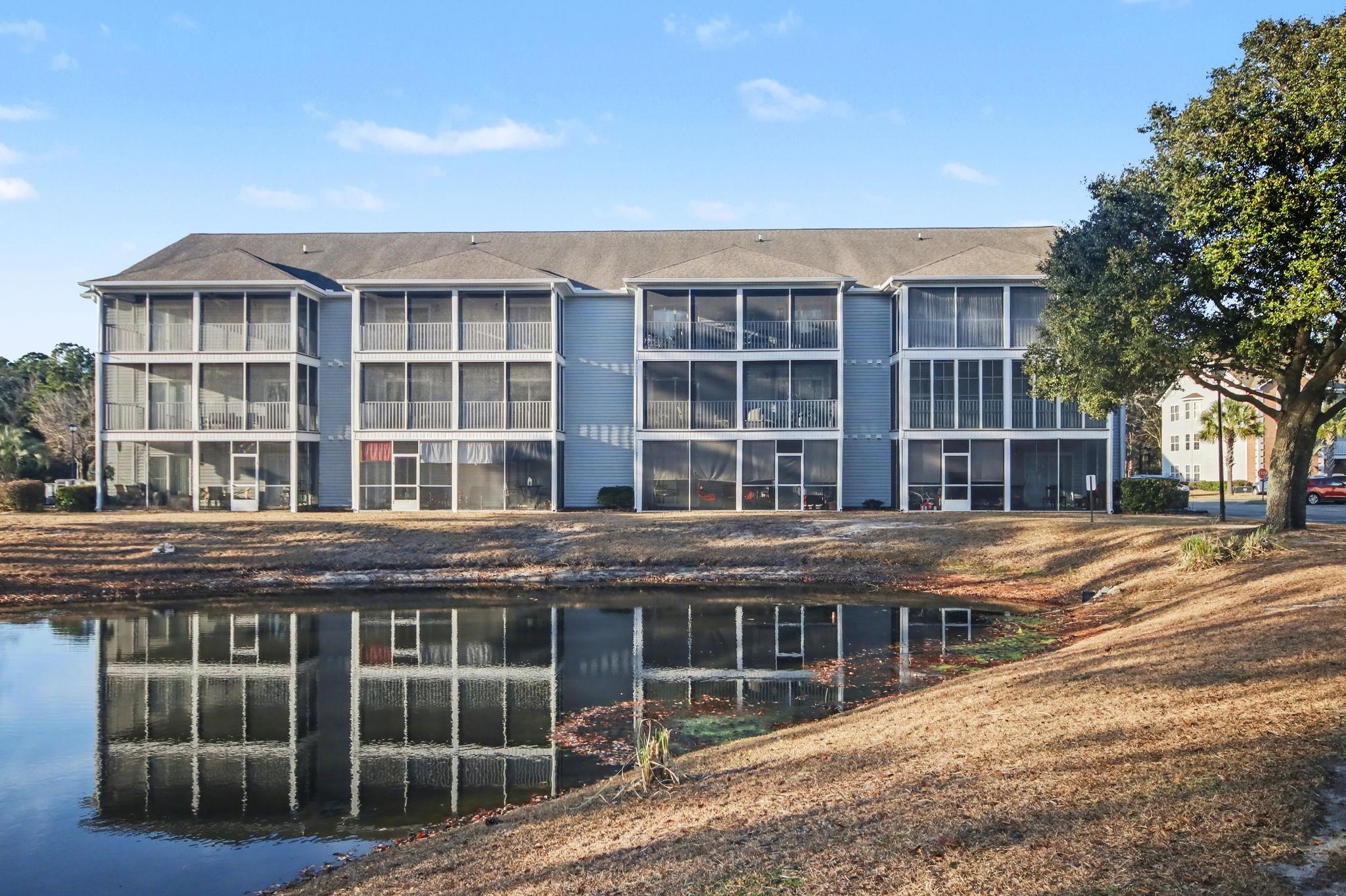 4853 Meadowsweet Drive, Unit 1807 Myrtle Beach, SC 29579 - Photo 35 of 40 View from the back of the building with a water view