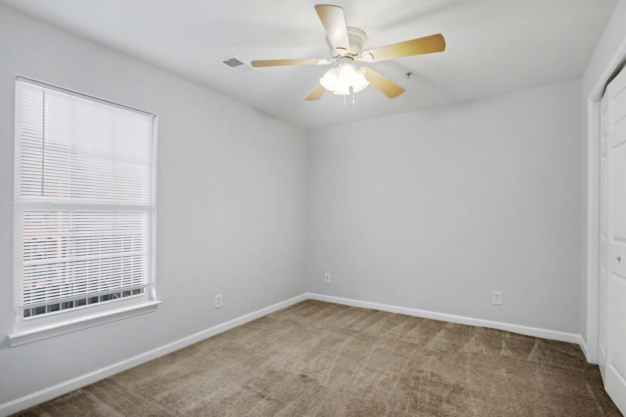 4853 Meadowsweet Drive, Unit 1807 Myrtle Beach, SC 29579 - Photo 6 of 40 Front right bedroom featuring a closet, light carpet and ceiling fan