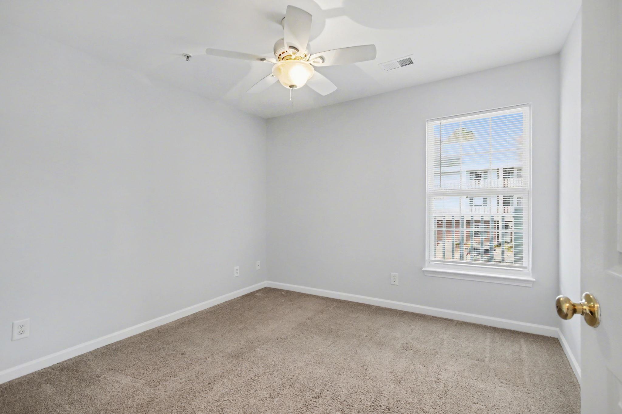 4853 Meadowsweet Drive, Unit 1807 Myrtle Beach, SC 29579 - Photo 10 of 40 Front left bedroom featuring a closet, light carpet and ceiling fan