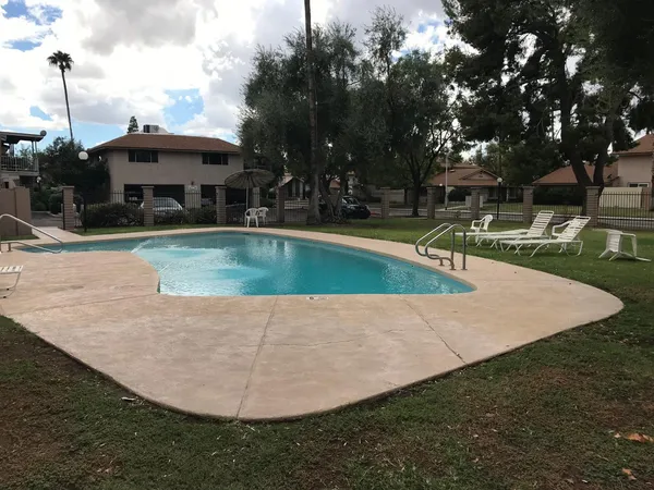 a view of a swimming pool with a patio