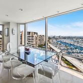 a city view with furniture and floor to ceiling windows