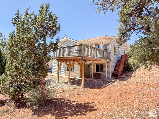 425 East Mule Deer Road Central, UT 84722 - Photo 3 of 72 Back of property featuring a wooden deck and stairs