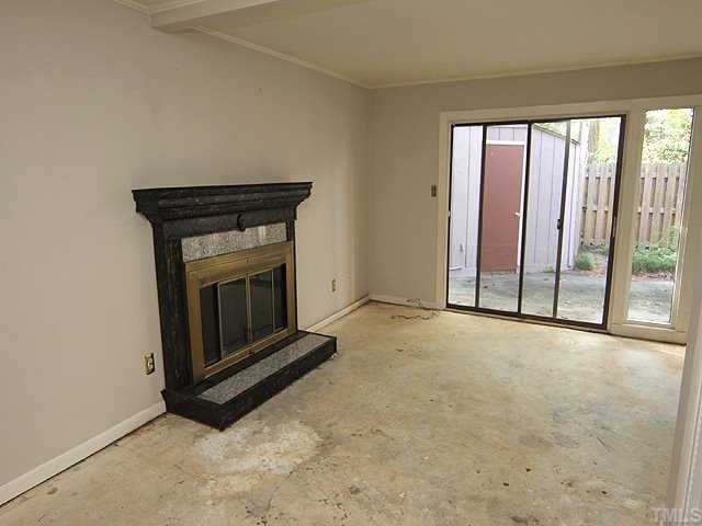 1764 Quail Ridge Road Raleigh, NC 27609 - Photo 2 of 10 a view of an empty room with a fireplace