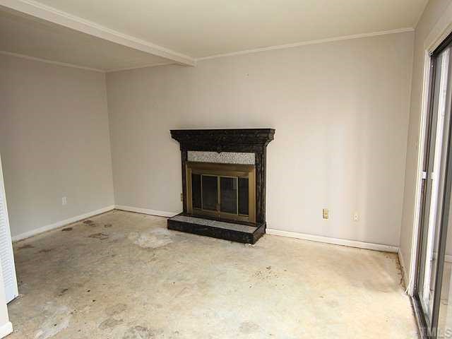 1764 Quail Ridge Road Raleigh, NC 27609 - Photo 3 of 10 an empty room with a fireplace