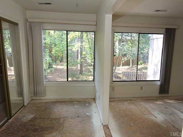 1764 Quail Ridge Road Raleigh, NC 27609 - Photo 8 of 10 a view of an empty room with large windows