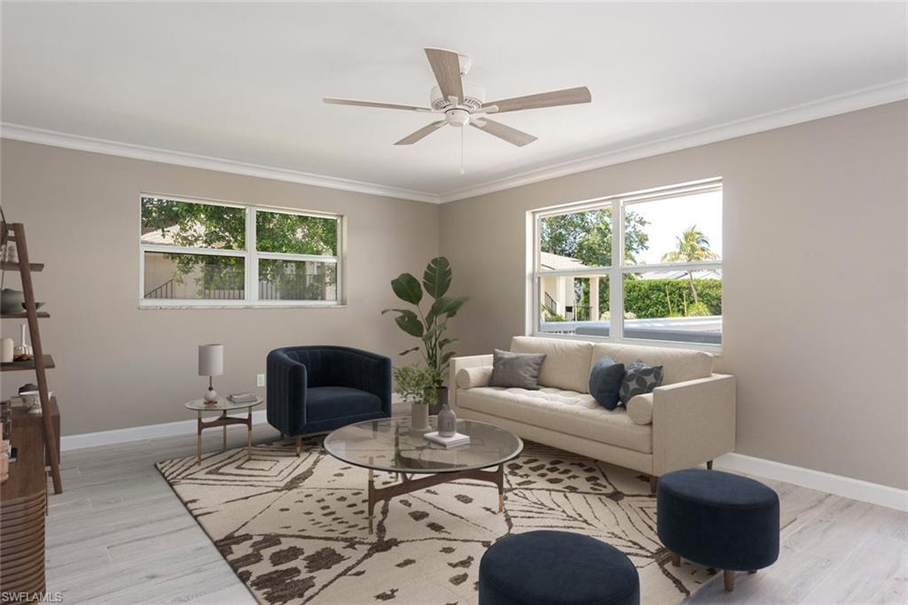 780 10th Avenue South, Unit 23 Naples, FL 34102 - Photo 6 of 15 a living room with furniture and a large window