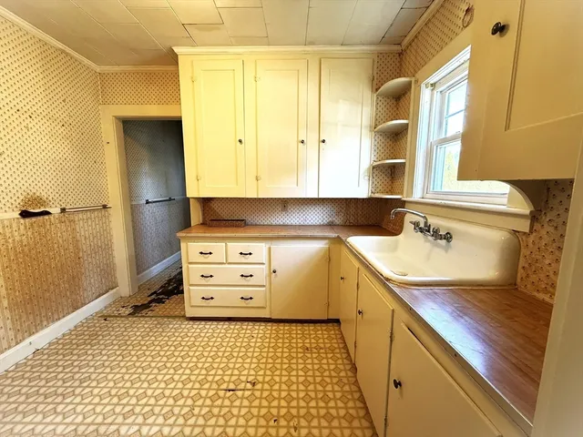 a bathroom with a granite countertop sink a toilet and a mirror