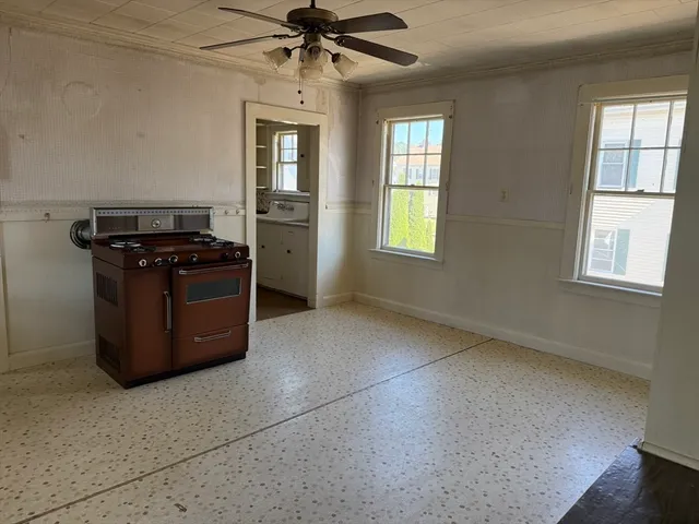 a kitchen with stainless steel appliances granite countertop a stove a sink dishwasher and a refrigerator