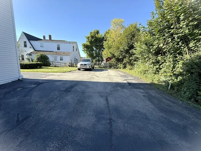 a view of a house with basketball court