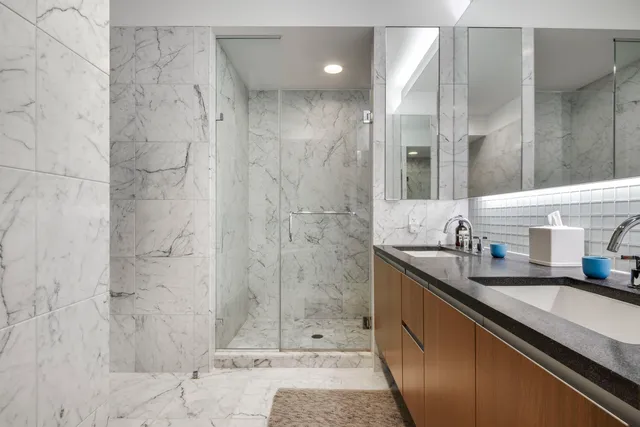 a bed room with a bed and a chair