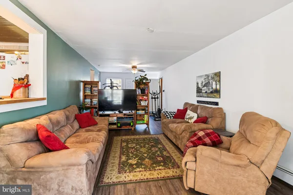 a dining room with furniture and window