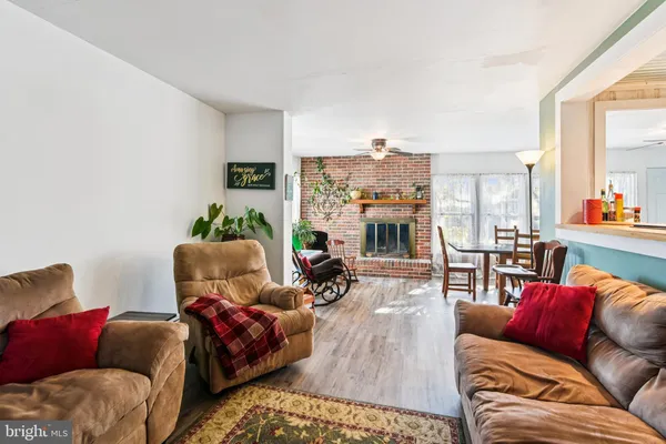 a bedroom with furniture and wooden floor