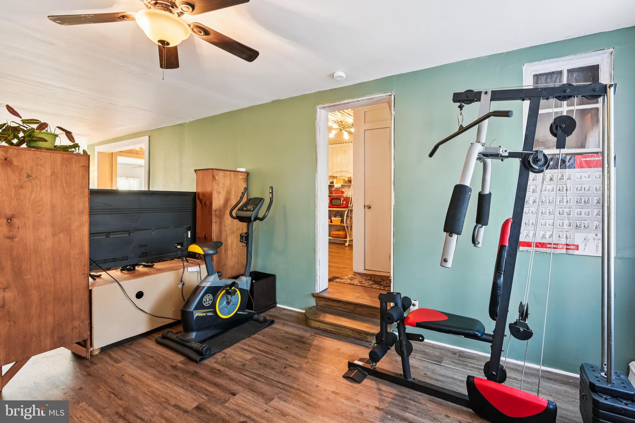 9266 Sharptown Road Laurel, DE 19956 - Photo 25 of 34 a bedroom with furniture and wooden floor