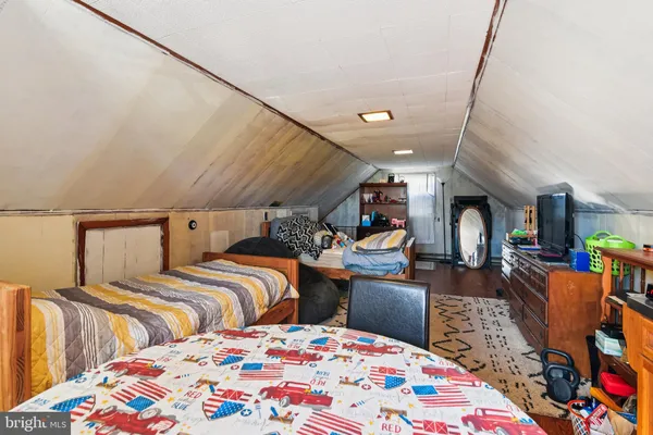 a bedroom with a bed and a table