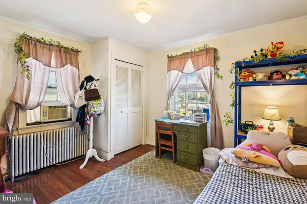 a bathroom with a sink toilet and shower curtain